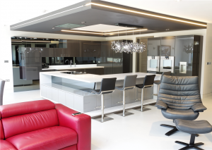 Corian Designer White Worktops with Gutmann Extractor and Gaggenau appliances and luxury Italian seating by Peressini Casa