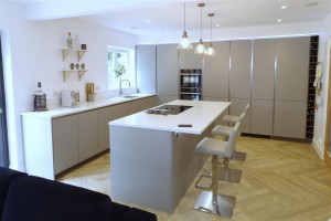 Minimalist Pearl Grey Kitchen with Silestone by Cosentino Miami white worktops with island, Neff appliances, Quooker tap and BORA Basic hob.