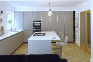Pearl Grey Kitchen with Neff Single Pyrolytic Oven, Compact oven with microwave, Quooker tap and BORA Basic hob.