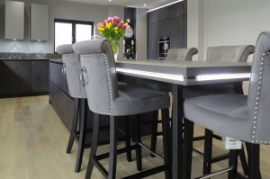 large open plan grey kitchen with island and connected breakfast bar